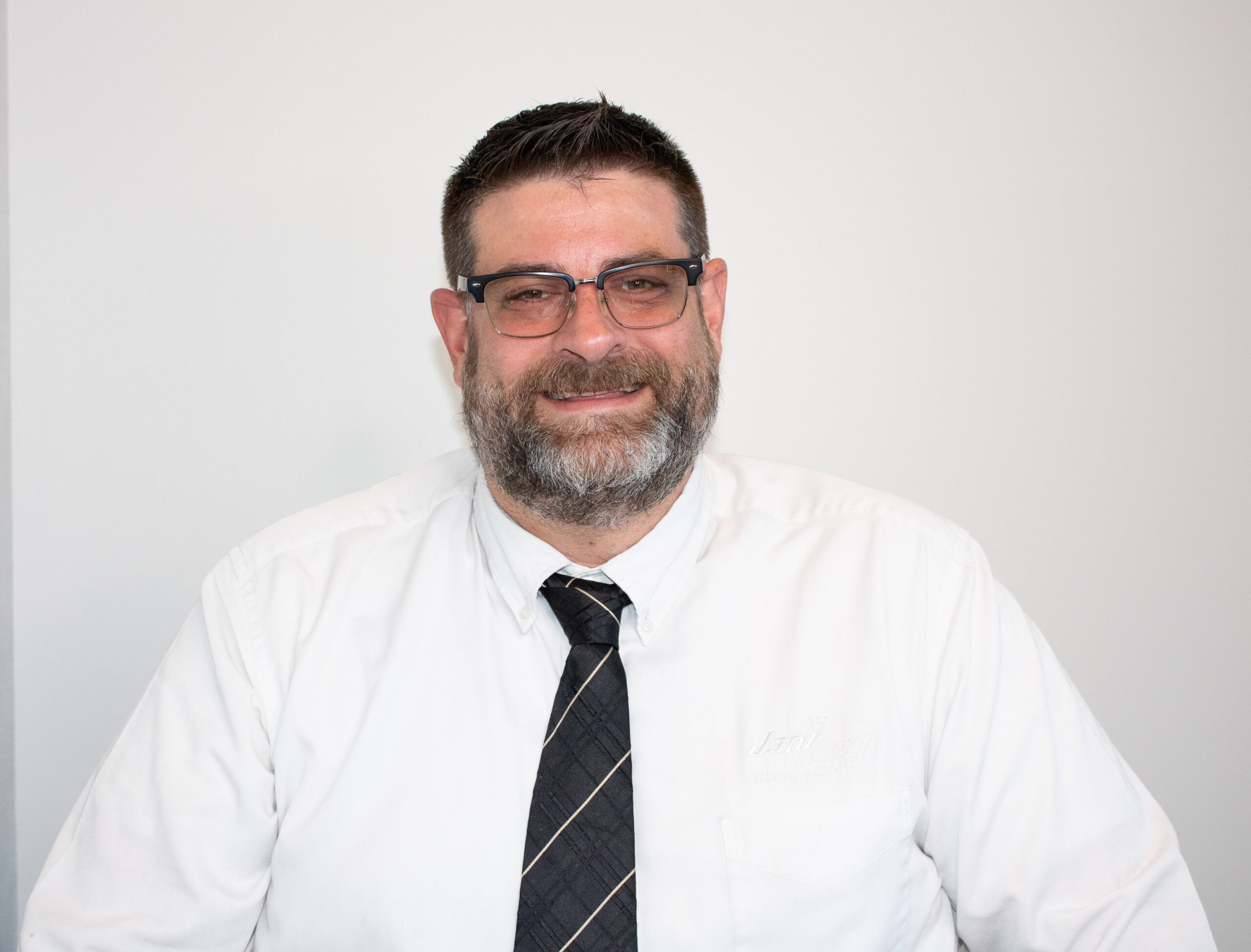 a man with a beard and glasses