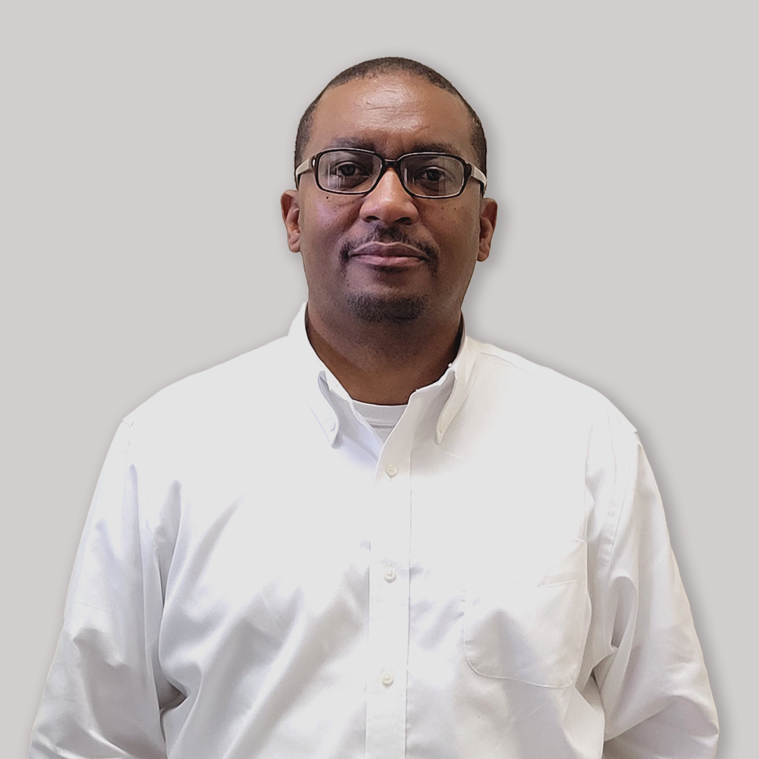 a man in a white shirt and glasses