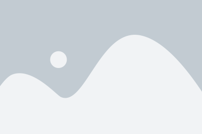 a white mountain with a gray sky in the background a white mountain with a gray sky in the background